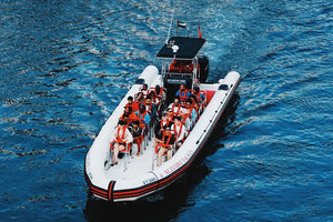 Boat with passengers on a body of water