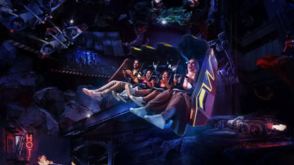 People riding a roller coaster at night with dark and dramatic lighting.